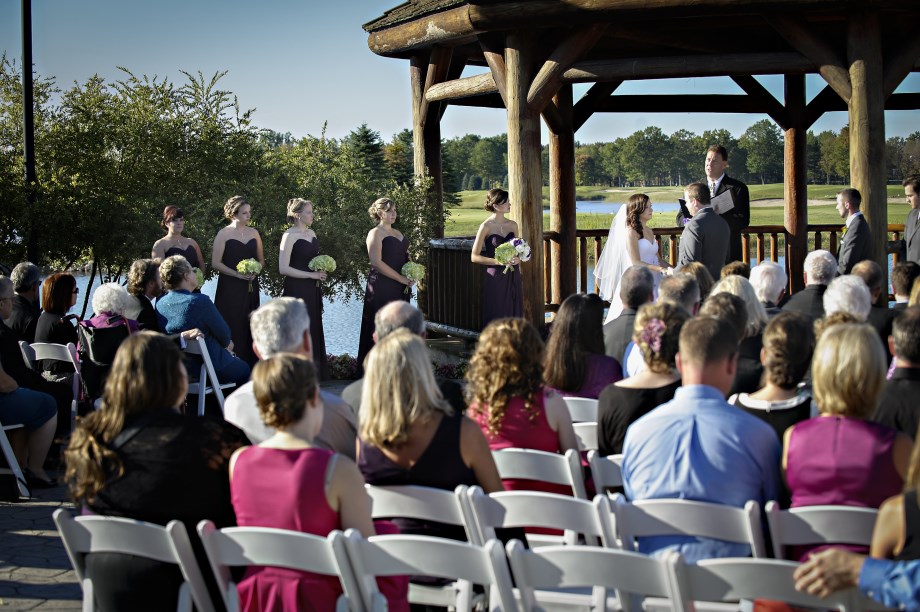 Guests attending an outdoor gazebo wedding ceremony at Solitude Links
