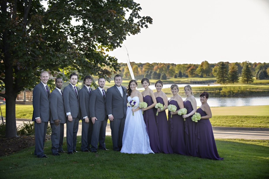 Wedding party photographed beside the water at Solitude Links